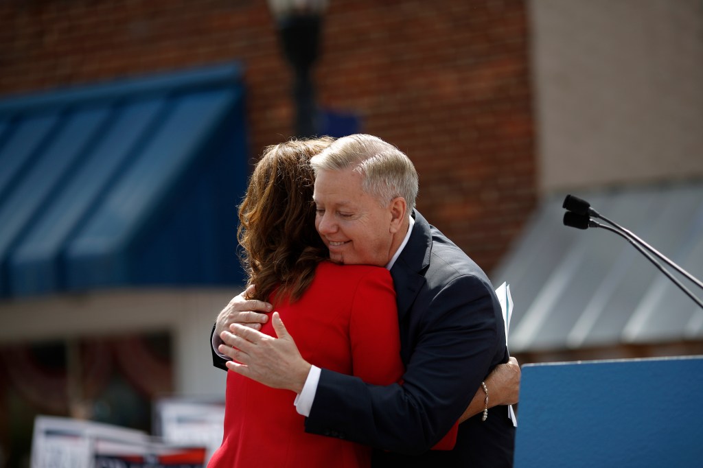 U.S. Senator Lindsey Graham embracing his sister Darline Graham Nordone at a presidential campaign announcement.