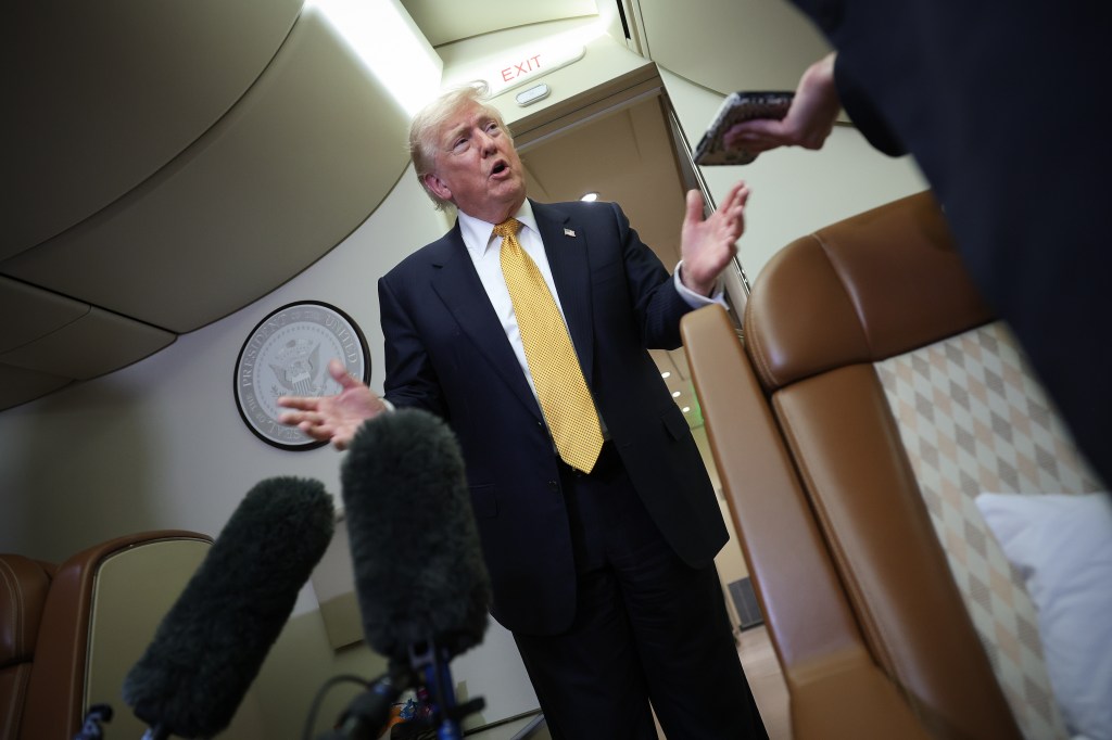 President Trump speaking to the press in Air Force One.