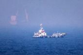 This picture shows ships sailing near the Strait of Hormuz off the eastern coast of the United Arab Emirates at Khor Fakkan on July 13, 2026.